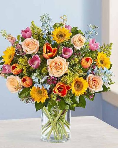 <p>There’s so much to love about spring…but it’s the bright, beautiful blooms that make it truly sensational! Our luxurious bouquet is gathered with a garden-fresh mix in shades of pink, blue, yellow and peach. Artistically designed, this gift delivers the best part of the season right to their door.</p>